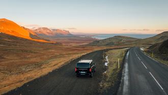A Car On The Road To Snaefellsnes Peninsula in iceland