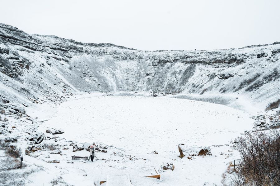 Tourists At Kerid Crater Covered In Snow in Iceland
