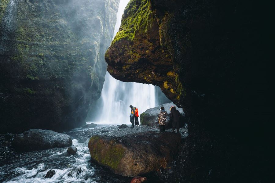 Tourists At Gljúfrabúi Waterfall in iceland