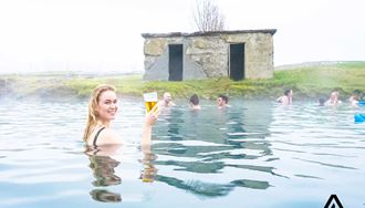 woman bathing in secret lagoon hot spring