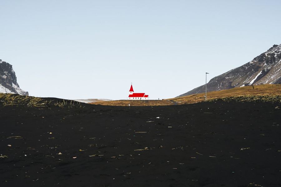 Vik Y Myrdal Church View From A Black Sand Beach in iceland