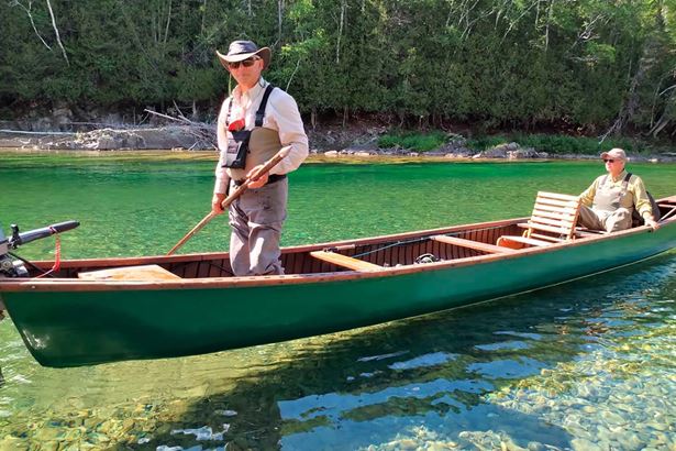 Two men in a wooden boat