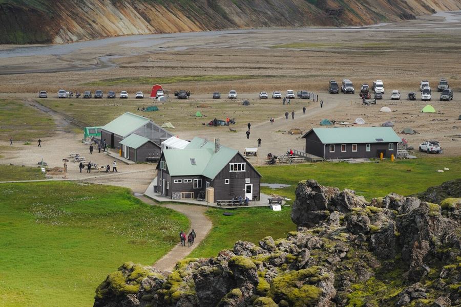 Campoing huts and green field at Landmannlaugar mountains 