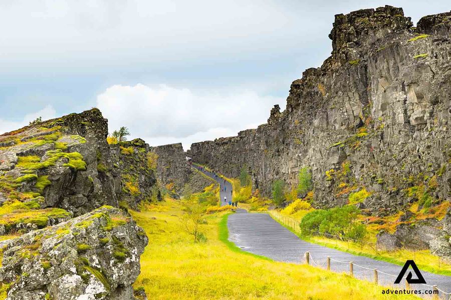 people walking the gravel path at thingvellir