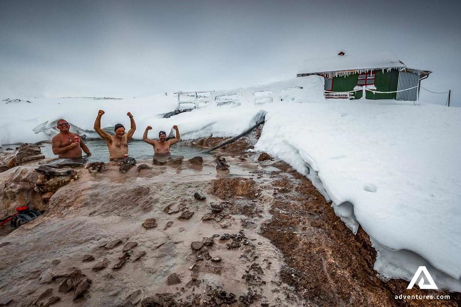 happy friends bathing in geothermal hot pool