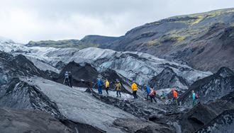 Glacier hike on black Icelandic glacier