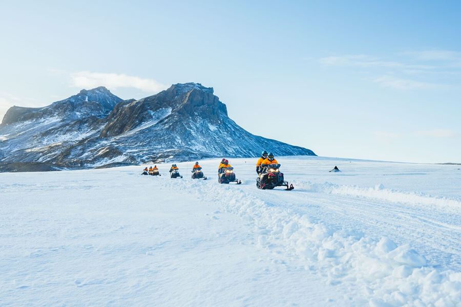 Group Of Snowmobiles On A Tour In Iceland