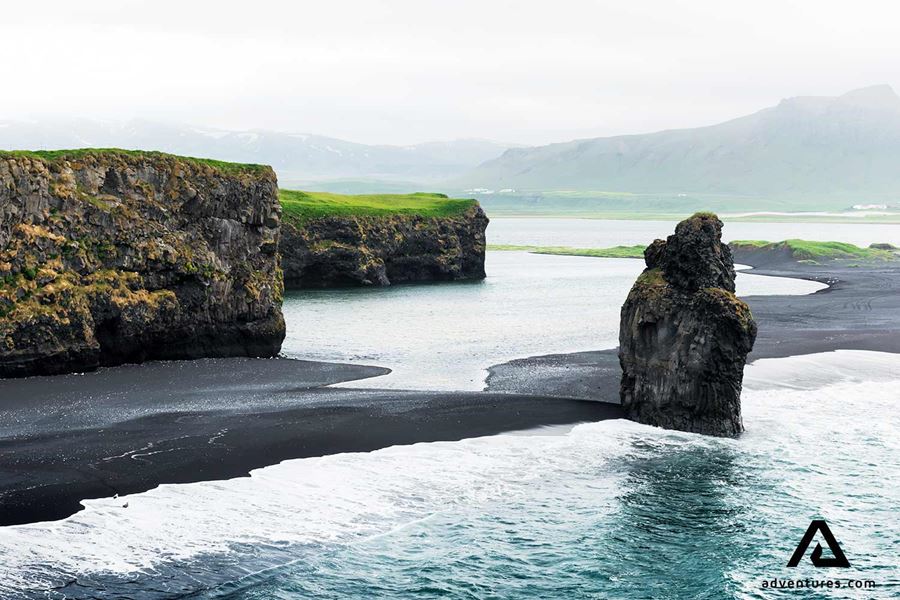 foggy view of arnardrangur in dyrholaey