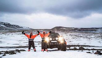 two happy friends on a winter jeep tour in iceland