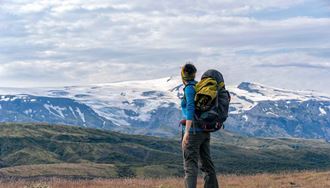 female hiker enjoying scenic view of eyjafjallajokull volcano