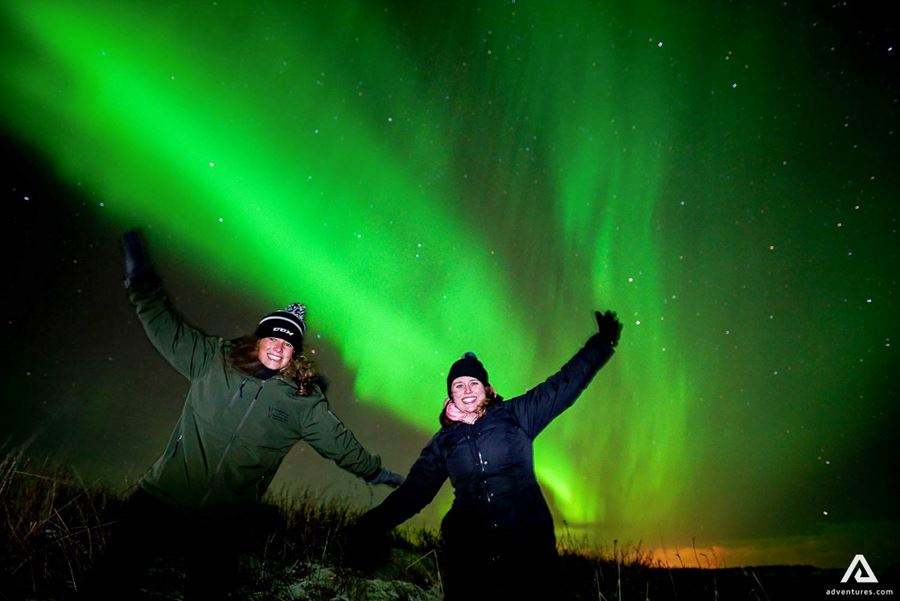 happy friends posing in iceland