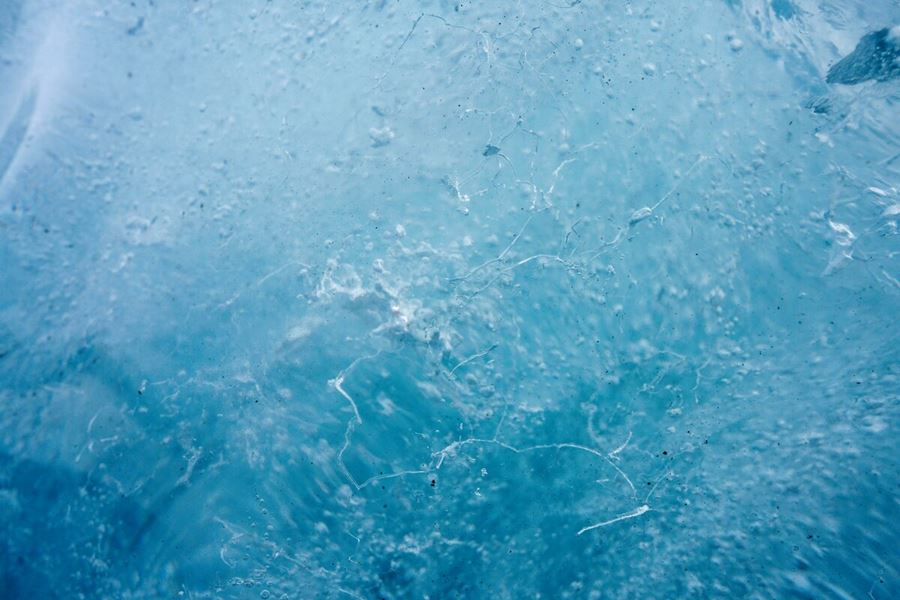 Blue ice with white bubbles inside