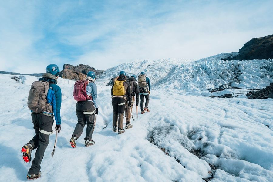 Small group tour hiking towards glacier crevasses at Vatnajokull.