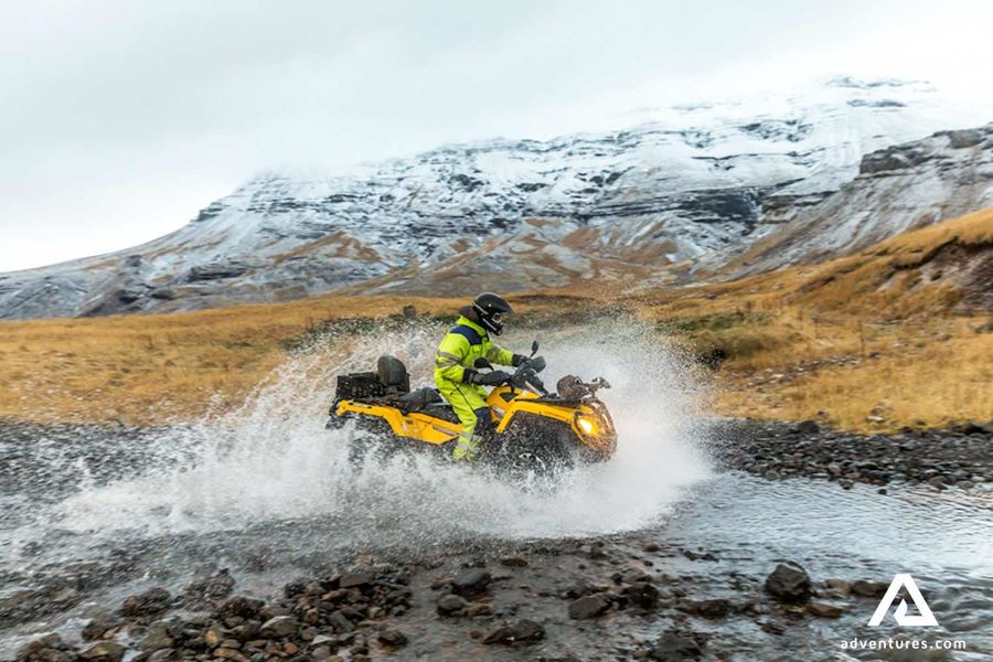 riding atv through a river