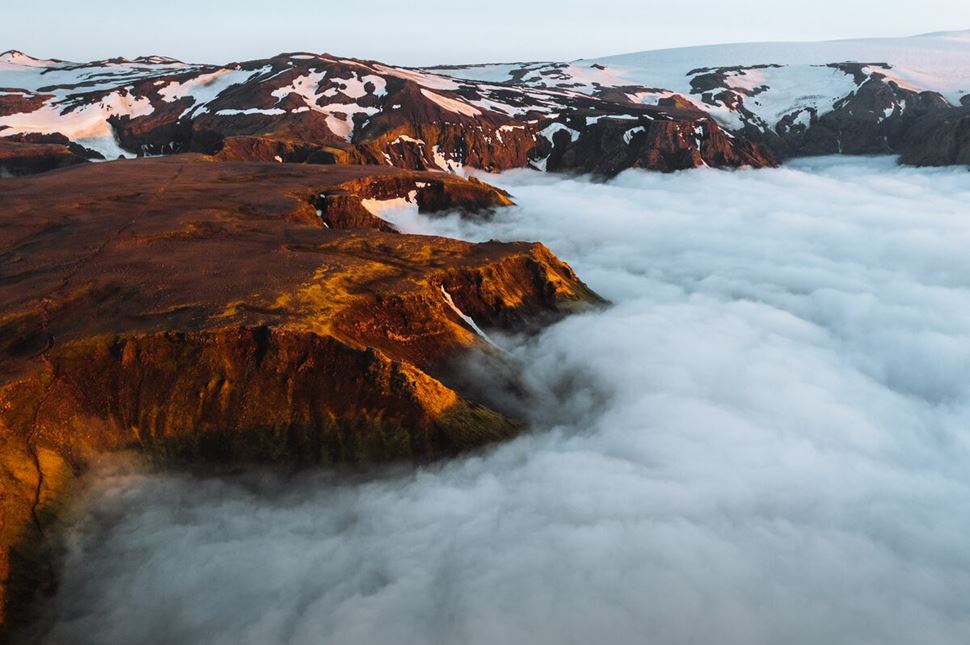 Fimmvorduhals view point in highlands, with a floor of thick clouds from mountain
