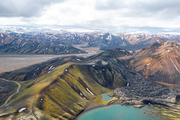 Ariel shot of multi colored Landmannalaugar mountain region and lake 