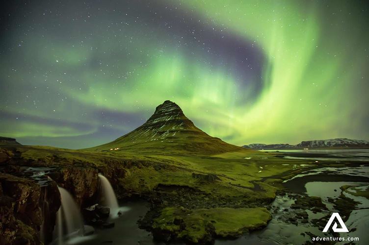 aurora borealis over kirkjufell mountain