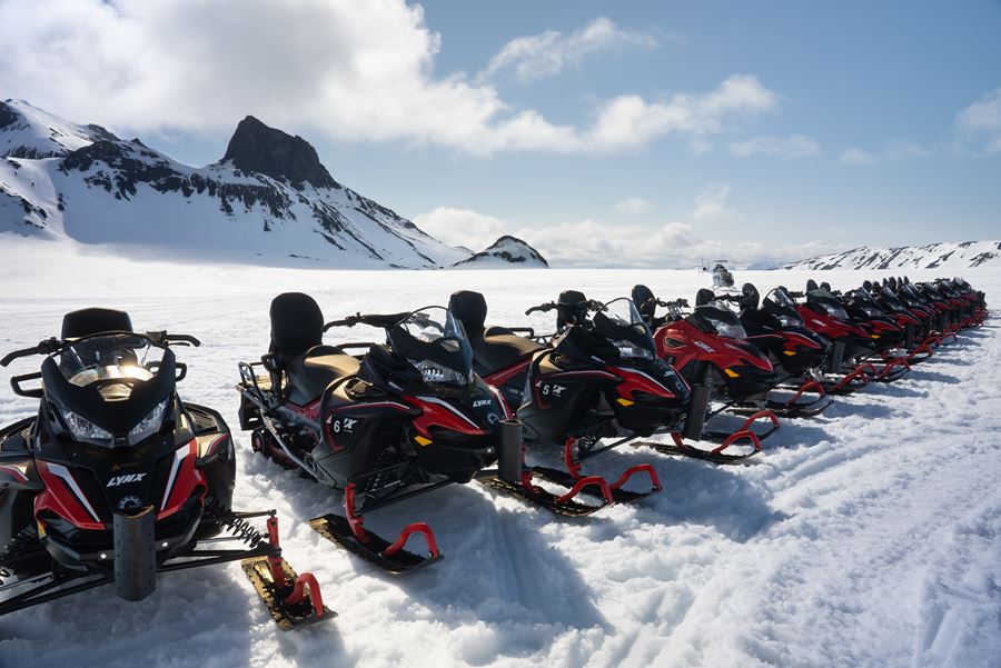 Snowmobiles Standing in Row