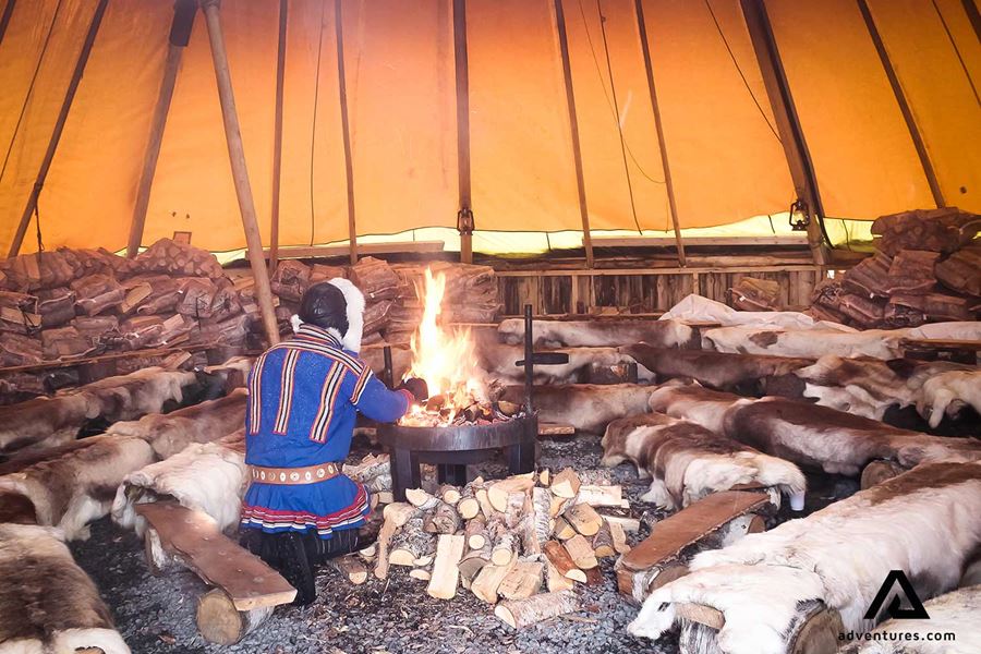 sami man lighting a fire