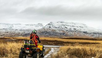 winter atv biking near mountains in iceland