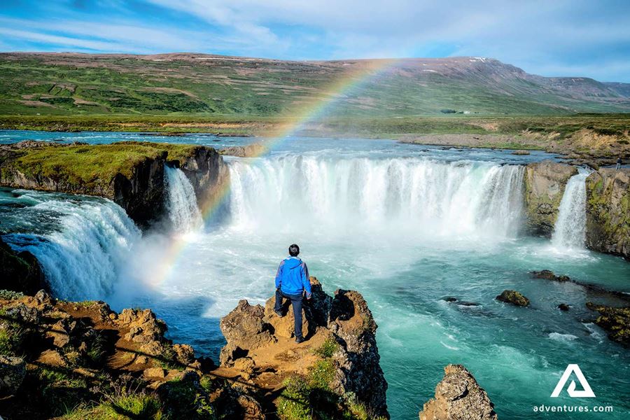 man standing near godafoss