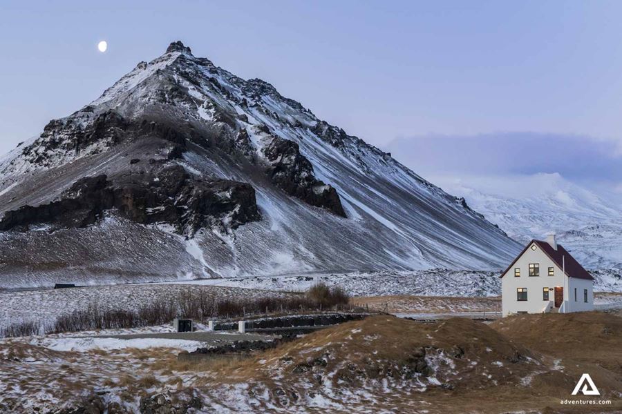 house near a mountain in arnarstapi