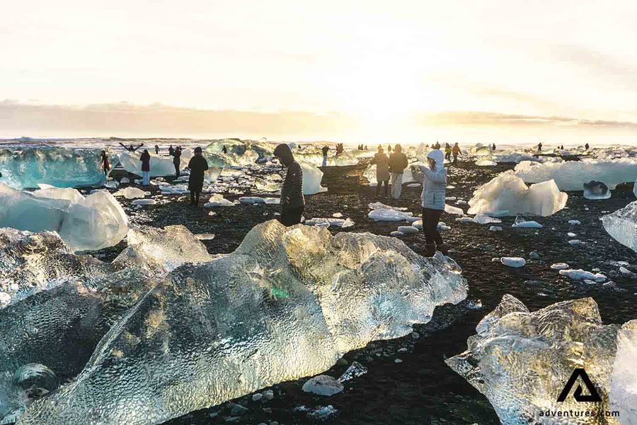 people walking around diamond beach