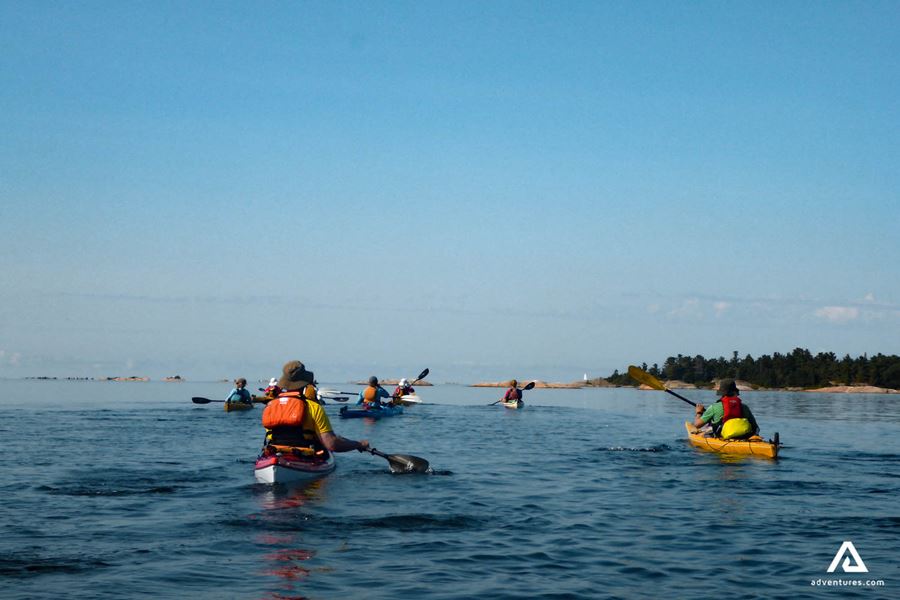 People Kayaking In The Ocean in Canada