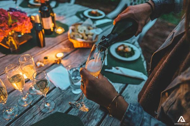 pouring champagne into a glass for celebration