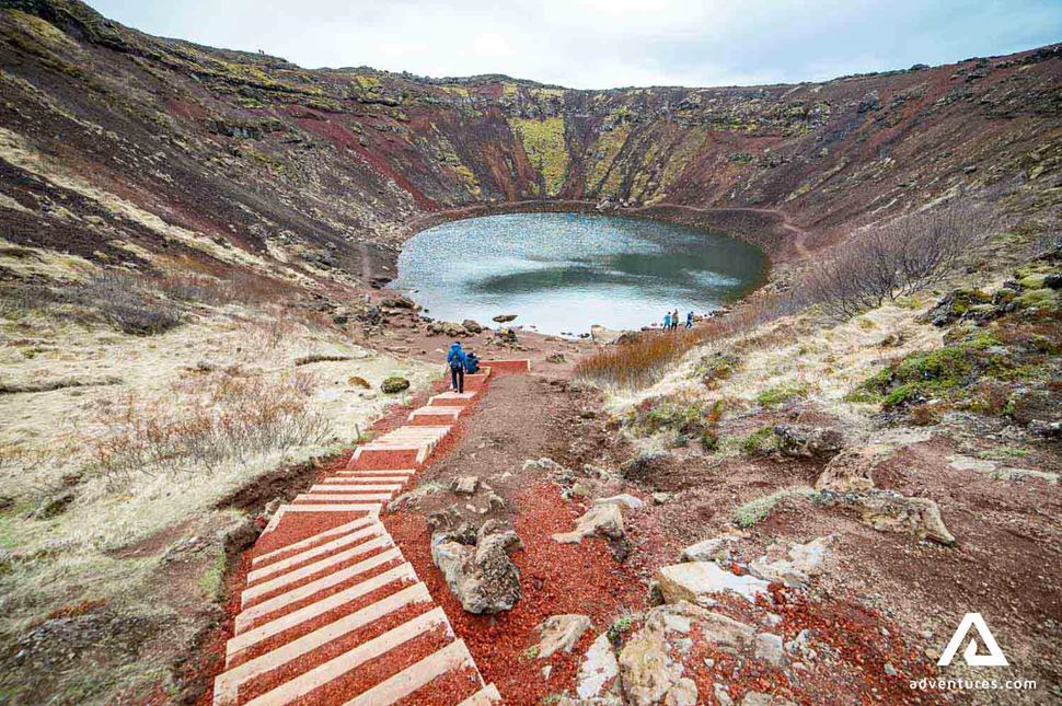 people walking down to kerid crater in iceland