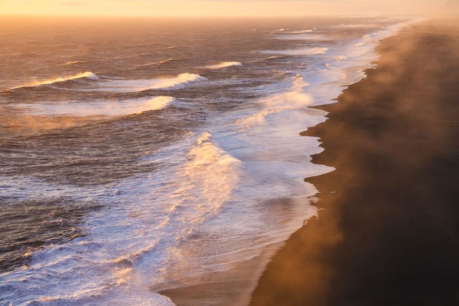 Waves Crashing On A Black Sand Beach In Iceland