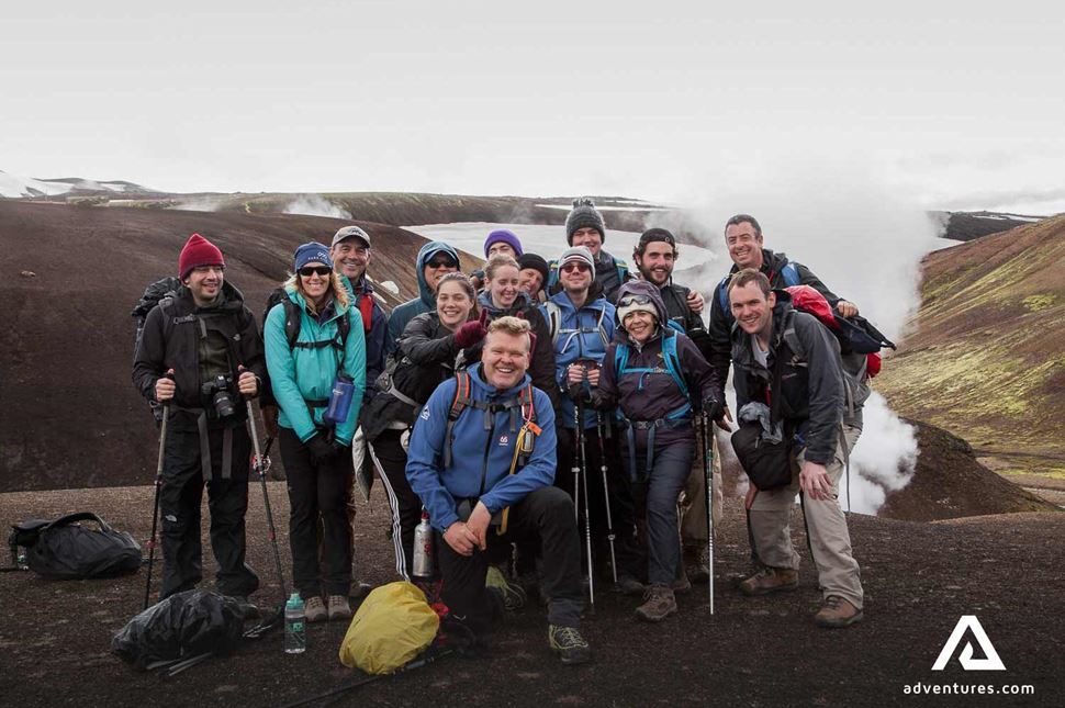 group of happy people in landmannalaugar in iceland